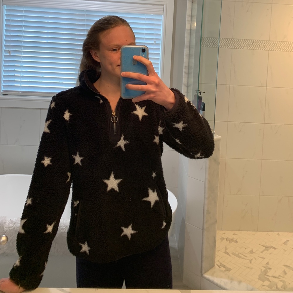Black fuzzy sweatshirt with white stars